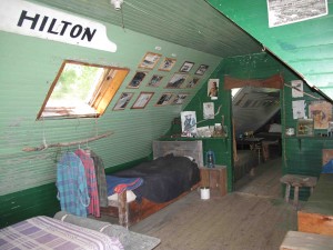 Caretaker Chuck Harris has covered the walls of the Ambajejus Boomhouse with photos and filled the rooms with appropriate artifacts eflecting Maine's River driving heritage. Hilary Nangle photo. 