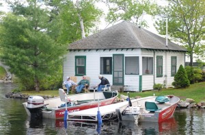 Fishermen swap tales by a cabin at Castle Island Camps. Tom Nangle photo. Fishermen have been coming to Maine's Belgrade Lakes Region for more than 100 years, and Castle Island Camps has been welcoming them since 1929. Tom Nangle photo.