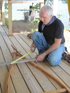 Chuck Harris, who saved Maine's Ambejejus Boom House and turned it into a museum, can often be seen on site building birchbark canoes. Hilary Nangle photo.
