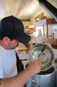 Chef William Howe prepares fish chowder aboard the Maine windjammer Angelique. Hilary Nangle photo. 