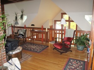 The loft is a fine place to steal away and read by the woodstove at the Crocker Pond House, Bethel, Maine. Hilary Nangle photo