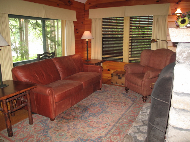 Big windows frame Sebago Lake from the varied cottages and suites at Migis Lodge. ©Hilary Nangle