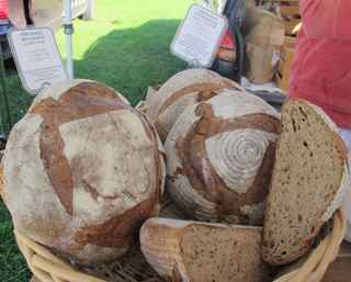 People line up to purchase bread from Barak Olins' Zu Bakery. hilary Nangle photo.