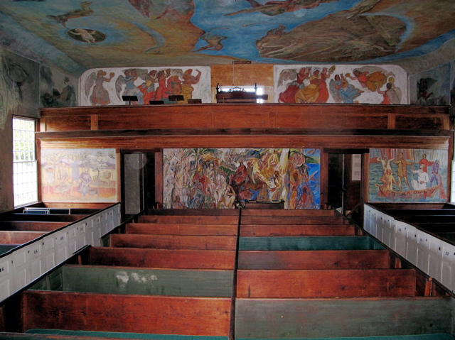 The ceiling, walls, choir loft, and entry of Maine's South Solon Meeting House are a riot of color and art. Hilary Nangle photo.