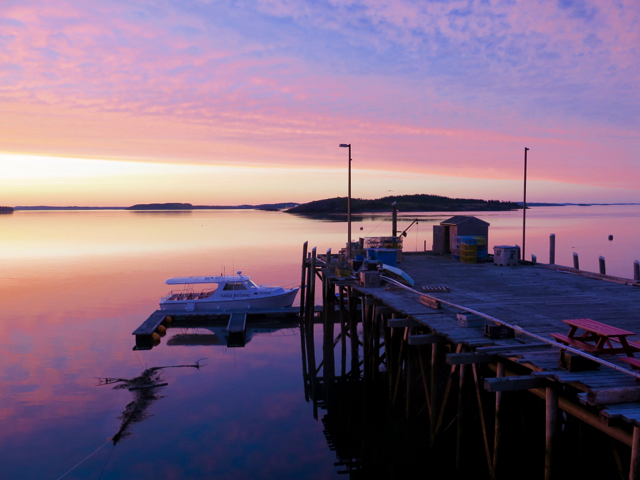 At sunset, gaze over Passamaquoddy Bay from the Inn at the Wharf in Lubec. ©Hilary Nangle