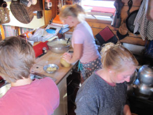 The wood-fueled cookstove is the galley's workhorse. 