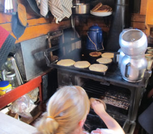 Prepping breakfast aboard the Maine windjammer J&E Riggin, which sails out of Rockland, Maine. ©hilary Nangle