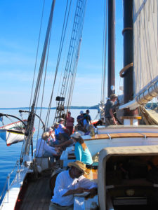 Passengers relax aboard the J&E Riggin. ©Hilary Nangle