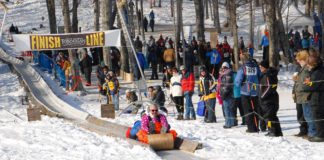 Participate in or watch the annual tobogganing championships at the Camden Snow Bowl.