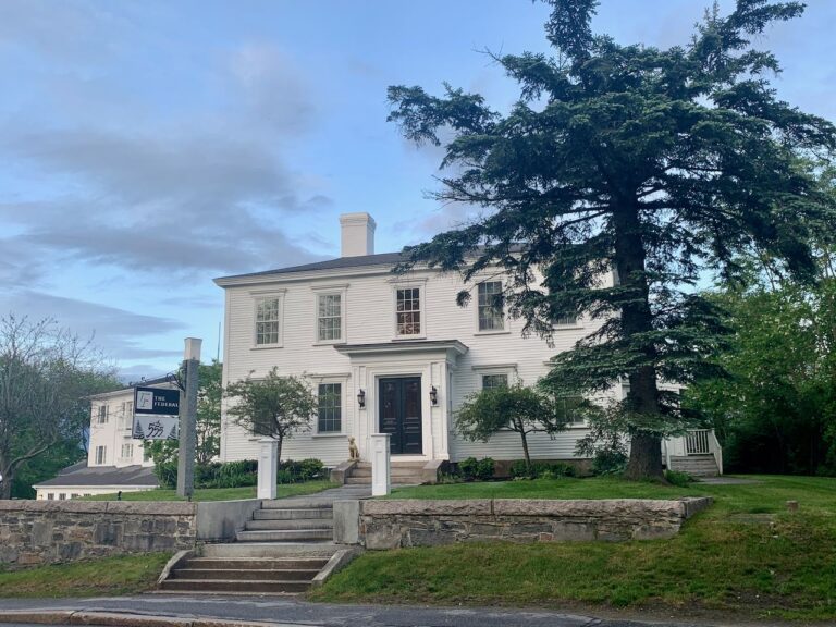 exterior of The Federal hotel's original federal-style building with the East wing in the background.