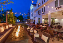 Outdoor patio with fireplace at Noble Kitchen & Bar. The Brunswick Hotel Review. courtesy photo